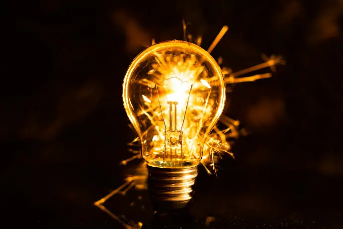 a light bulb with a flame